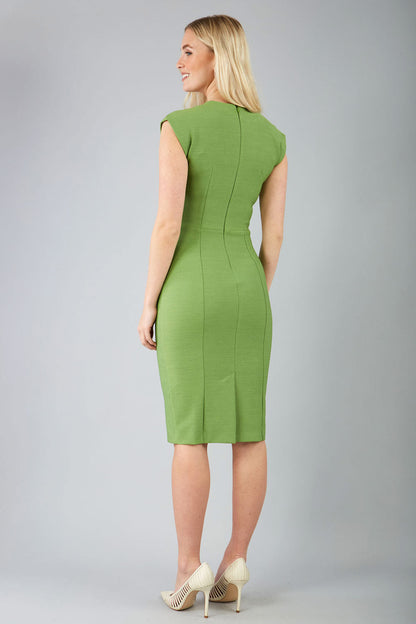 blond model wearing a diva catwalk seed lucca tie detail cap sleeves pencil dress in citrus green colour front image