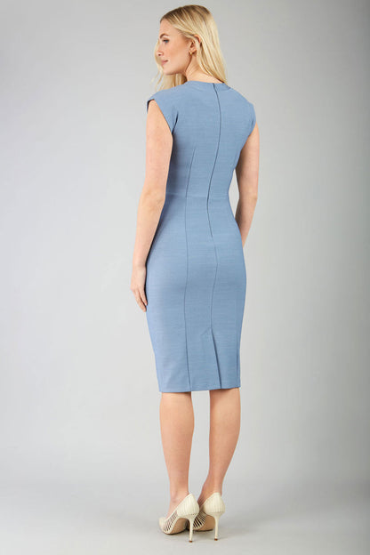 blond model wearing a diva catwalk seed lucca tie detail cap sleeves pencil dress in steel blue colour front image