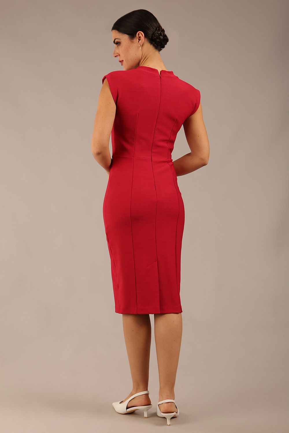 brunette model wearing a diva catwalk seed lucca tie detail cap sleeves pencil dress in crimson pink colour front image