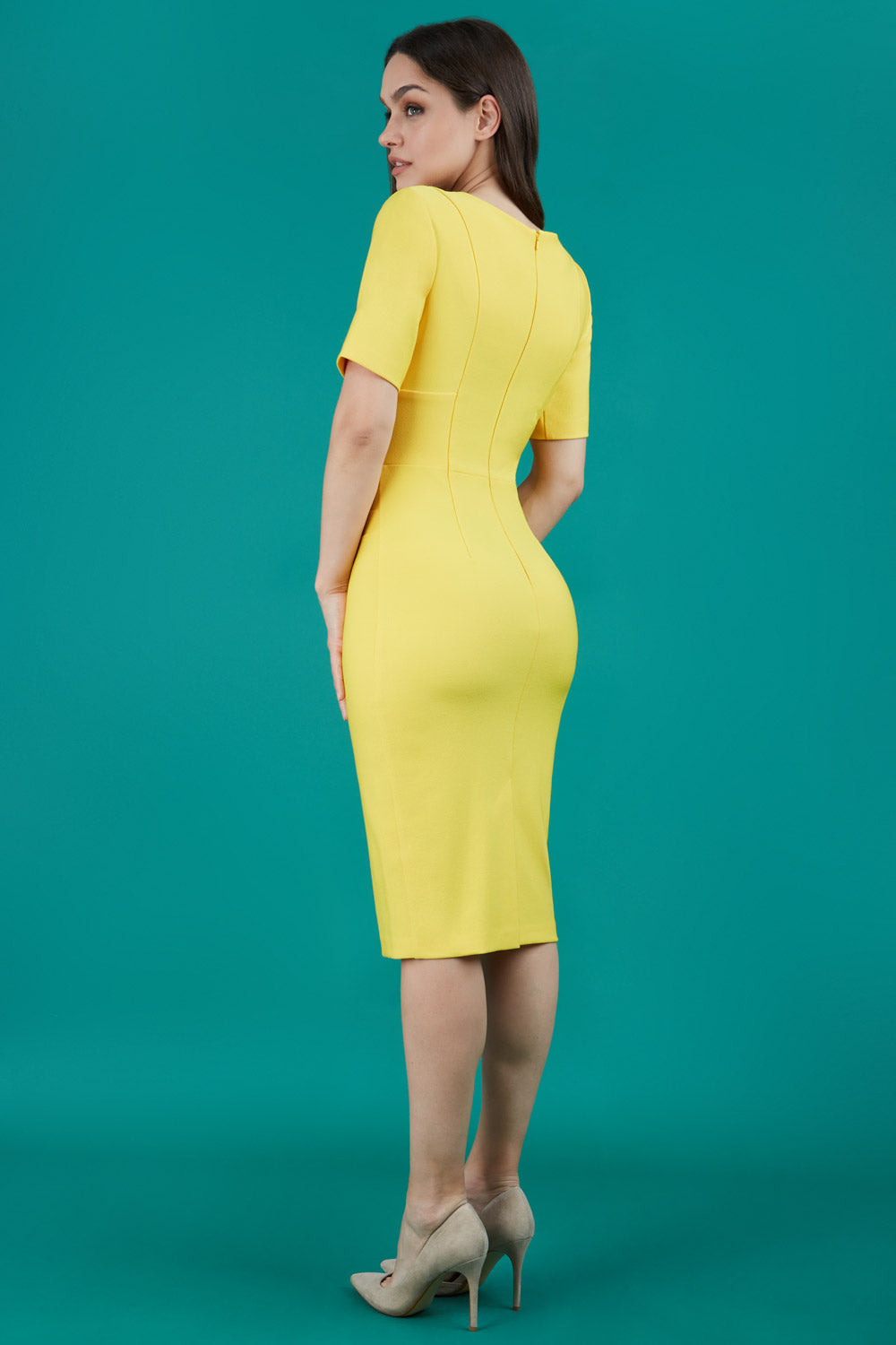 model is wearing diva catwalk seed barton short sleeve pencil dress with v-neck in daffodil yellow front 