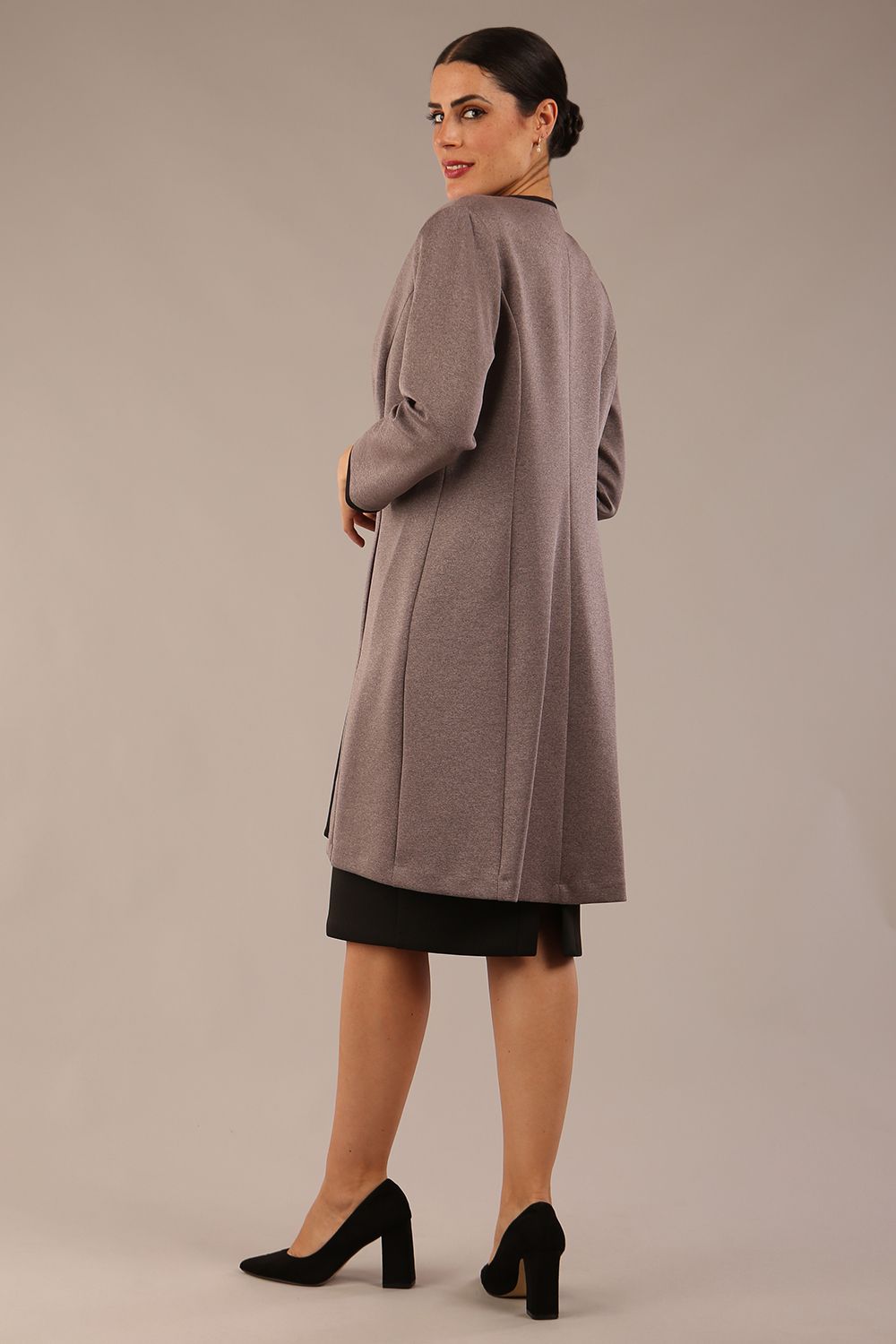 Model wearing the Diva Alverstone Coat in Mist Pink and black front image    