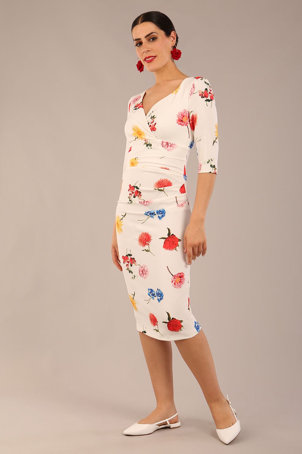 brunette model is wearing a diva catwalk Cynthia Floral Print Dress sleeved crossover v neckline knee length in Buttercup Print back image