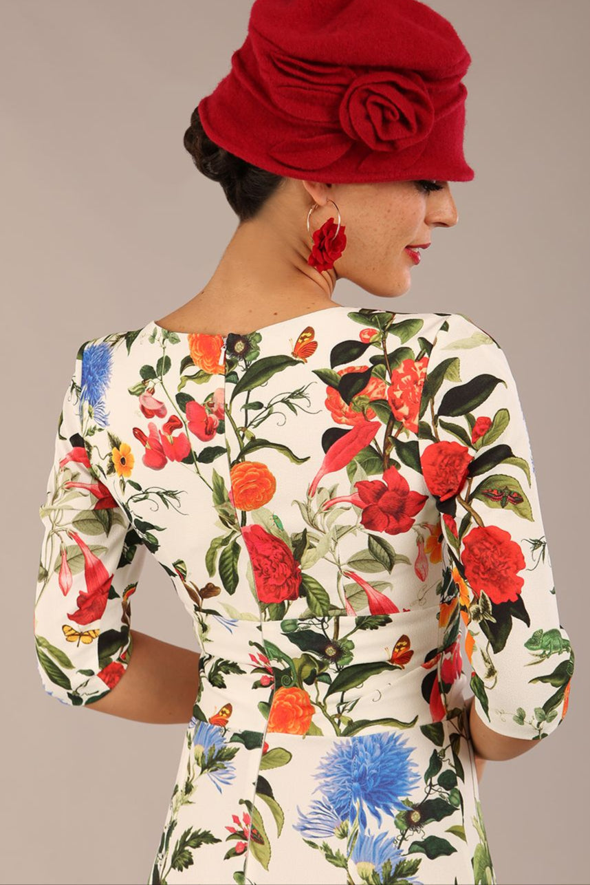 brunette model is wearing a diva catwalk Cynthia Floral Print Dress sleeved crossover v neckline knee length in Eden Print front image