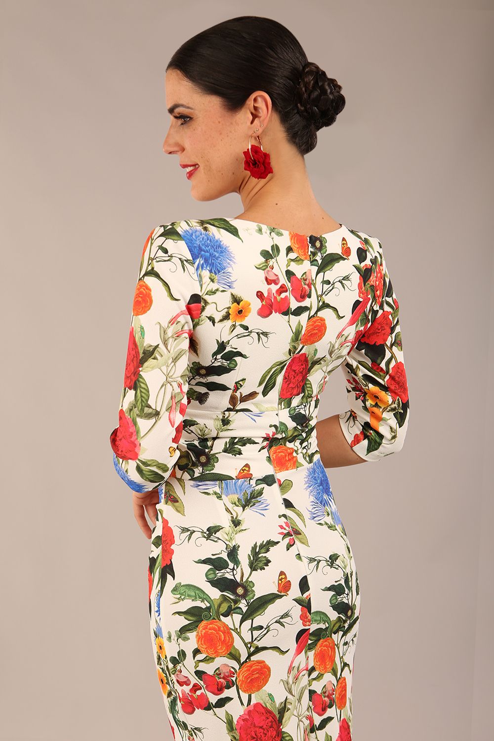 brunette model is wearing a diva catwalk Cynthia Floral Print Dress sleeved crossover v neckline knee length in Eden Print front image