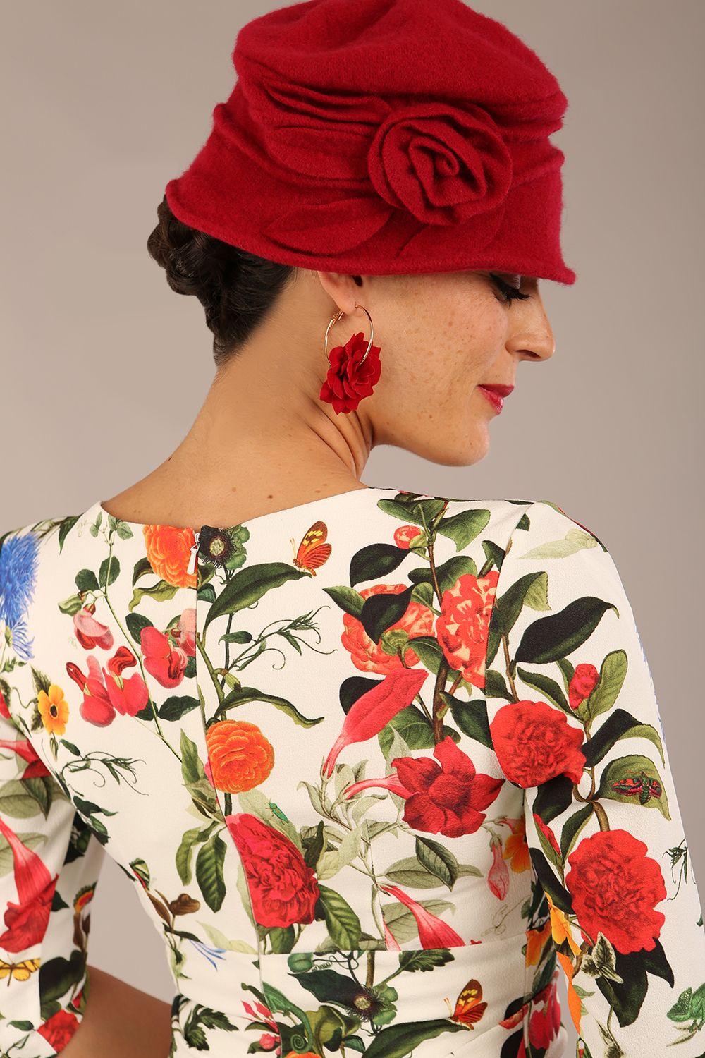 brunette model is wearing a diva catwalk Cynthia Floral Print Dress sleeved crossover v neckline knee length in Eden Print front image
