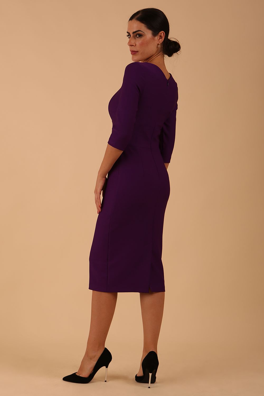 Model wearing diva catwalk Seed Divine Dress 3/4 sleeved knee length in imperial purple colour