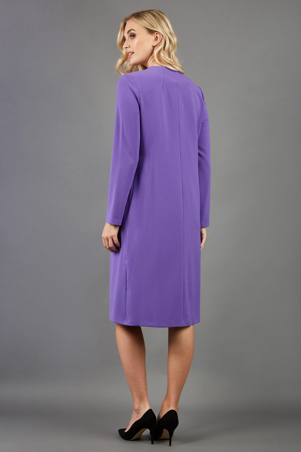 blonde model wearing the Diva Bliss Coat with round neckline in opulent violet front image