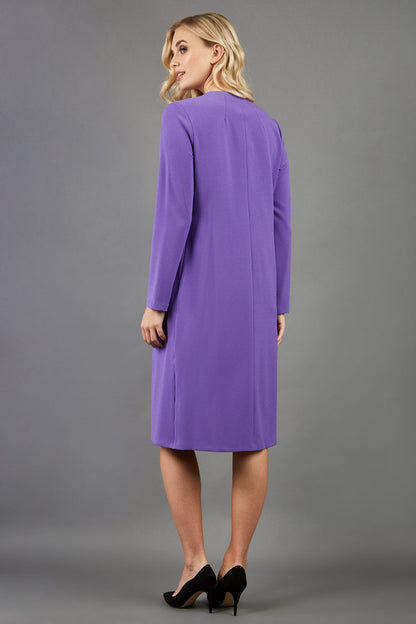 blonde model wearing the Diva Bliss Coat with round neckline in opulent violet front image