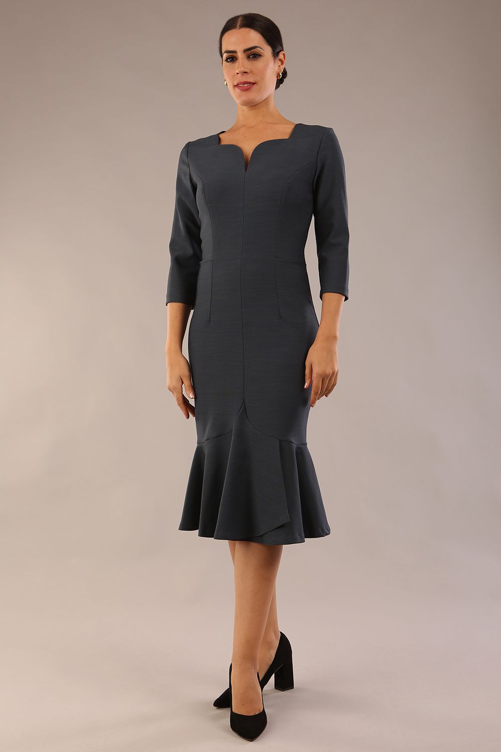 model is wearing a diva catwalk Seed Brecon Fishtail Sleeved Dress in slate grey colour side front