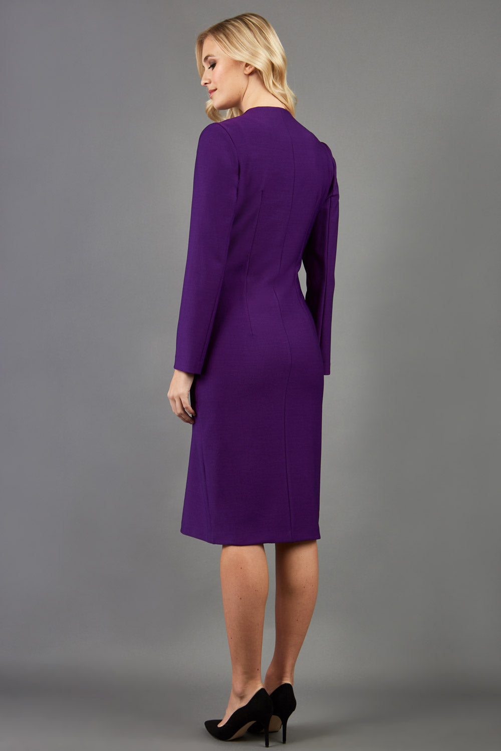 blonde model wearing the Diva Silverstone Coat with V neckline in imperial purple front image