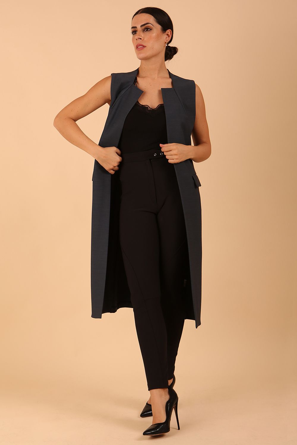 model wearing a divacatwalk Seed Harvard Sleeveless Coat midi length in Slate Grey colour front side