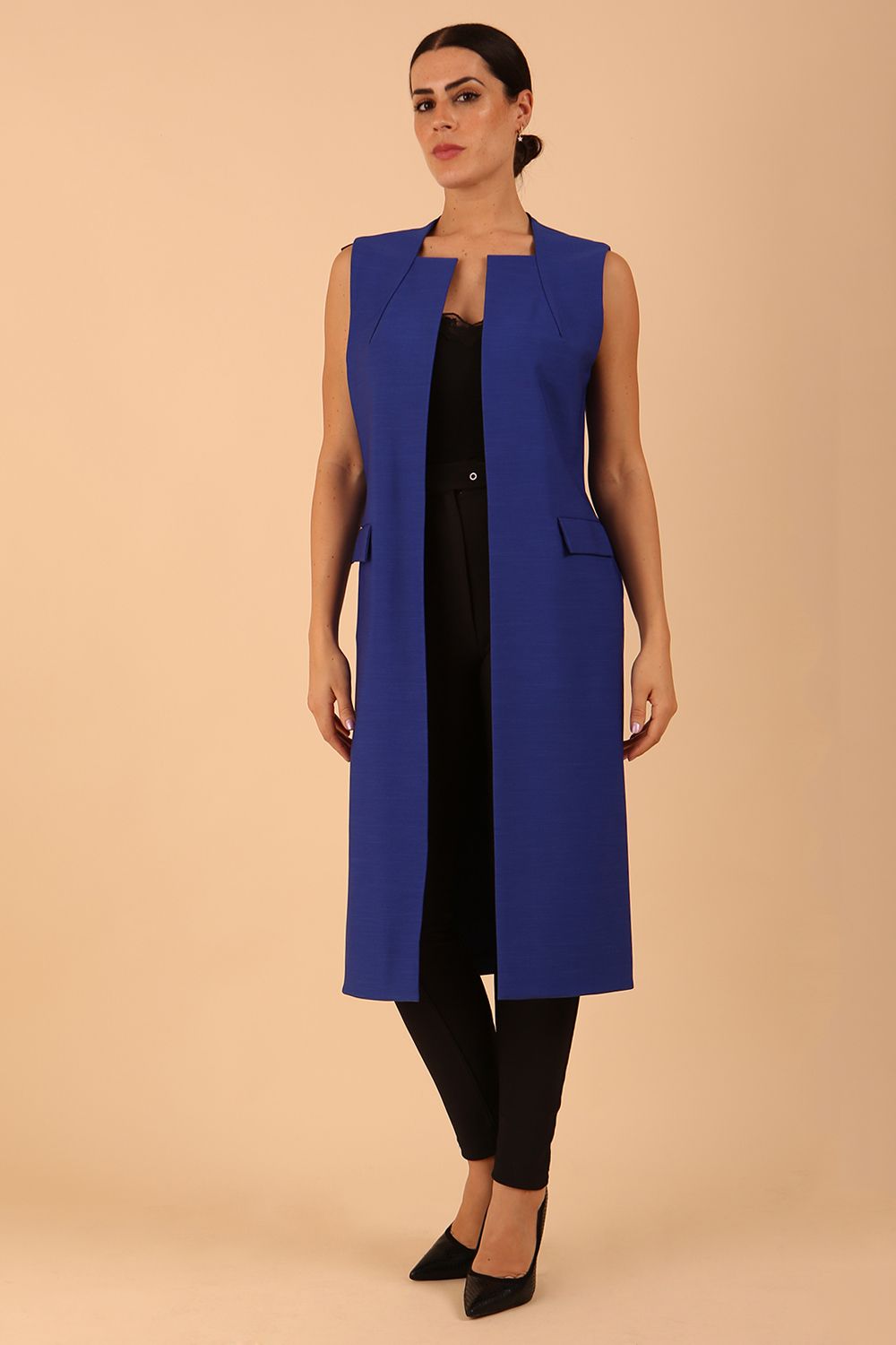 model wearing a divacatwalk Seed Harvard Sleeveless Coat midi length in Monaco Blue colour front
