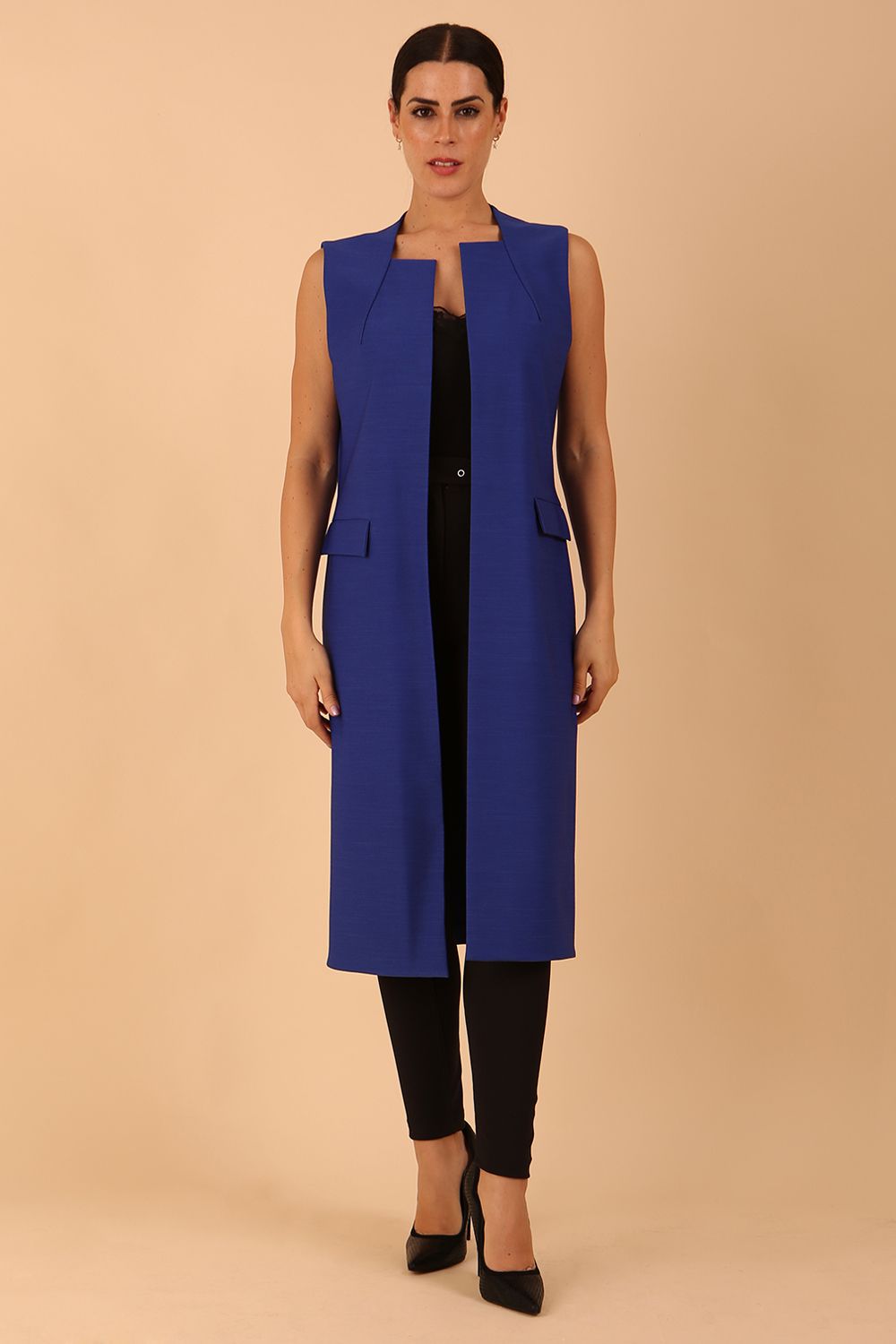 model wearing a divacatwalk Seed Harvard Sleeveless Coat midi length in Monaco Blue colour front