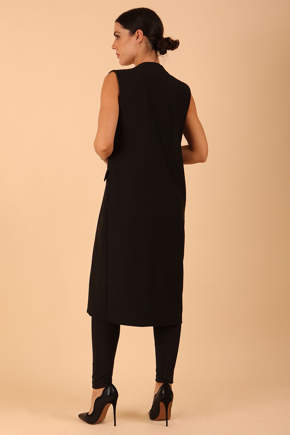 model wearing a divacatwalk Seed Harvard Sleeveless Coat midi length in black colour front