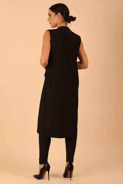 model wearing a divacatwalk Seed Harvard Sleeveless Coat midi length in black colour front