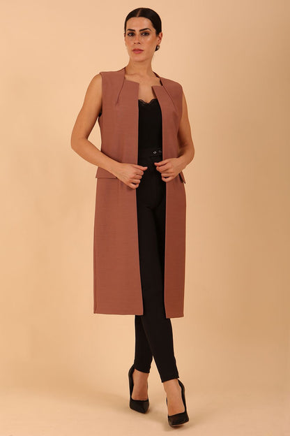model wearing a divacatwalk Seed Harvard Sleeveless Coat midi length in Acorn Brown colour front