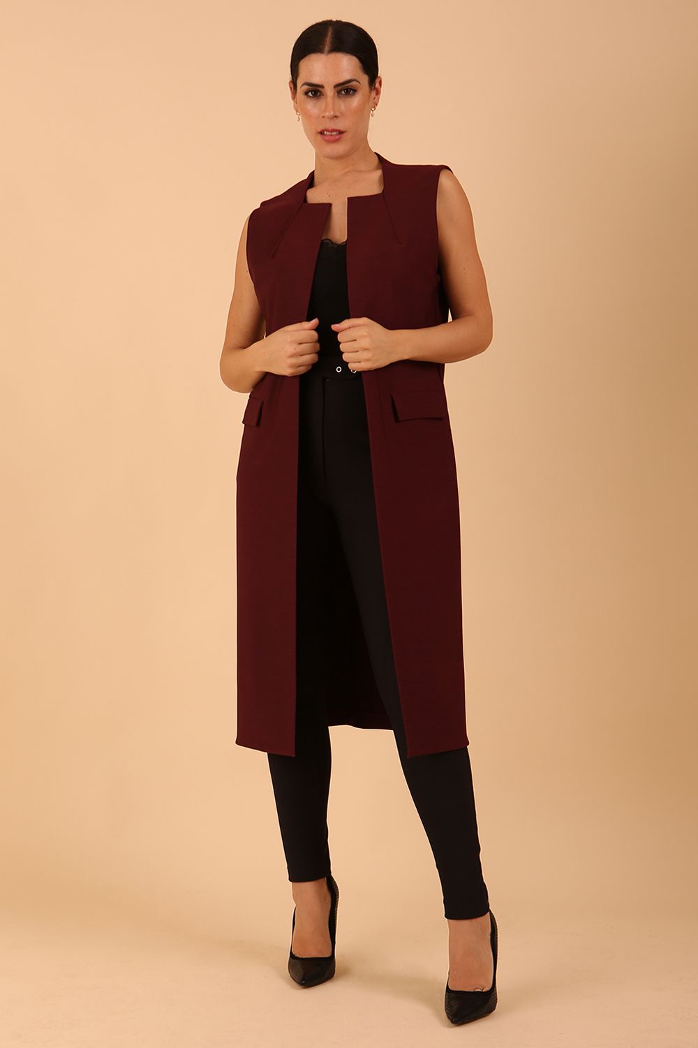 model wearing a divacatwalk Seed Harvard Sleeveless Coat midi length in Port Royale colour front