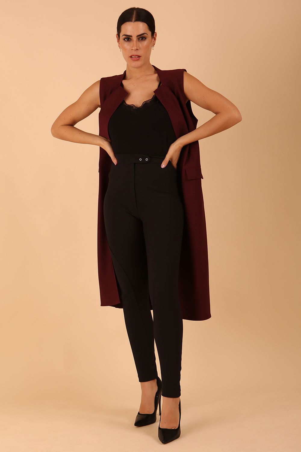 model wearing a divacatwalk Seed Harvard Sleeveless Coat midi length in Port Royale colour front