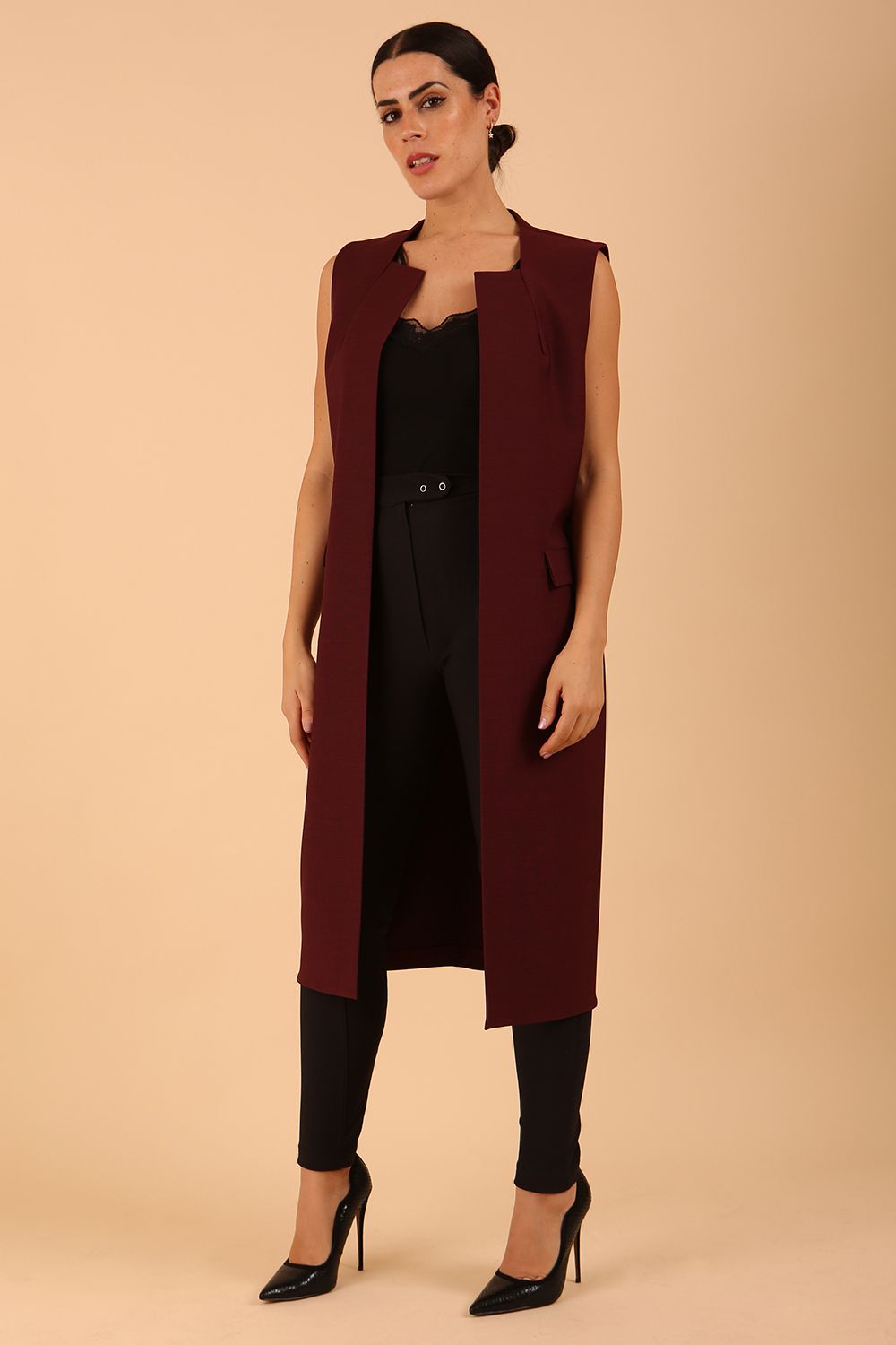 model wearing a divacatwalk Seed Harvard Sleeveless Coat midi length in Port Royale colour front