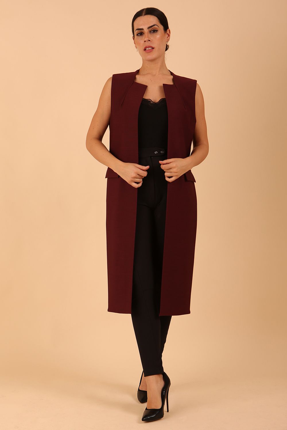 model wearing a divacatwalk Seed Harvard Sleeveless Coat midi length in Port Royale colour front