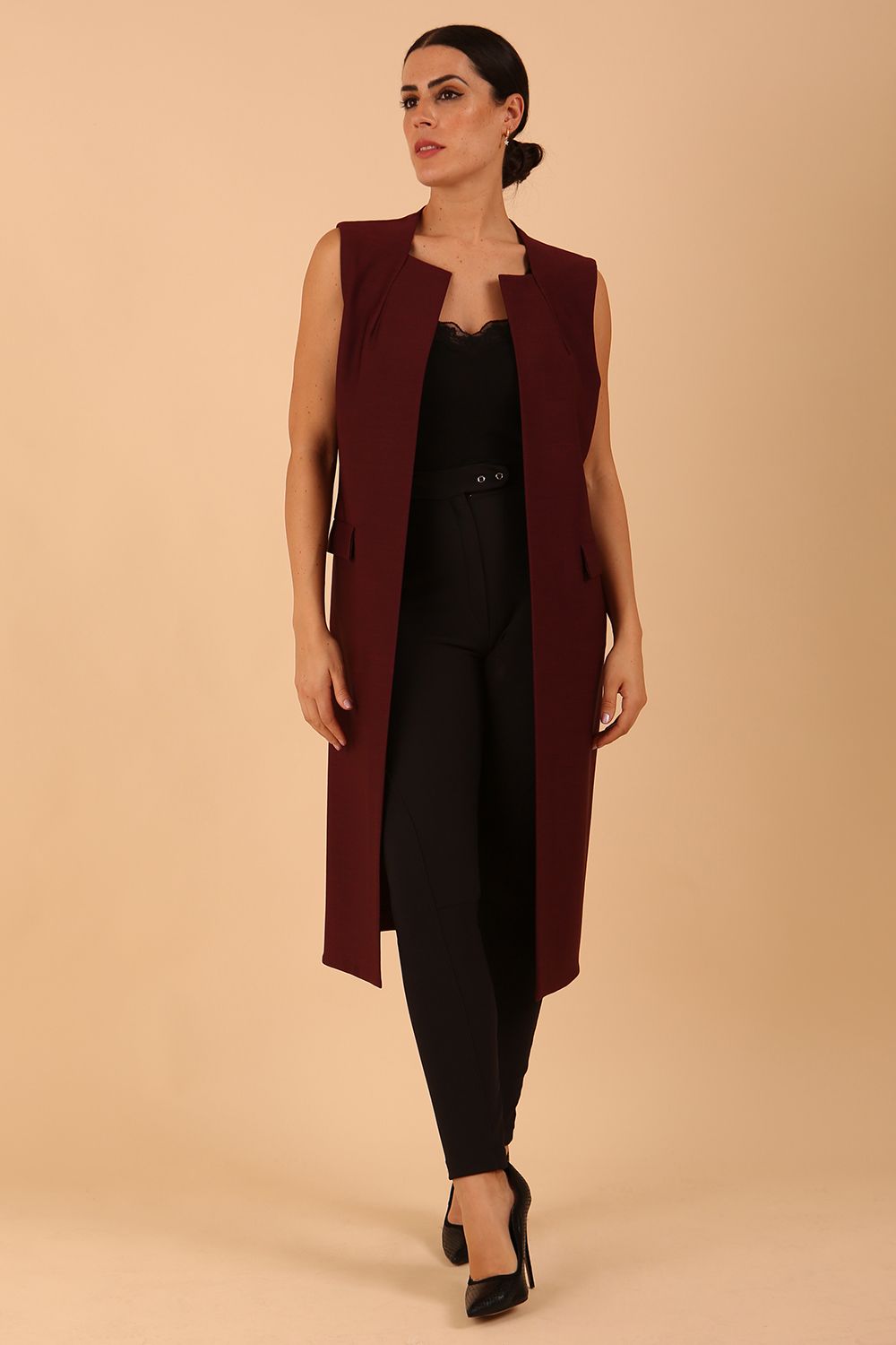 model wearing a divacatwalk Seed Harvard Sleeveless Coat midi length in Port Royale colour front