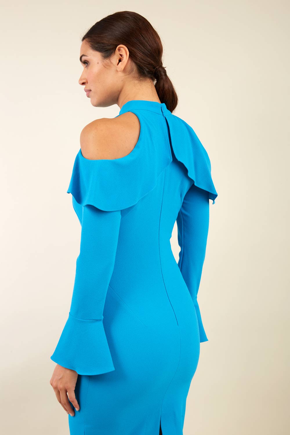 brunette model is wearing diva catwalk liah long sleeve cold-shoulder pencil dress with high neck in tropic teal front