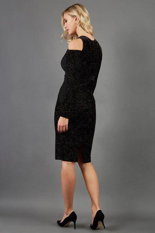 blonde model is wearing diva catwalk partyon glitter pencil dress with cold shoulder in black front