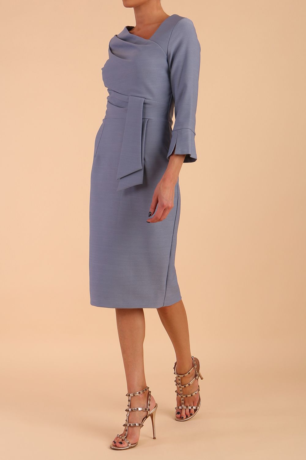 Model wearing diva catwalk Seed Orla Asymmetric Pencil Dress in Steel Blue front side