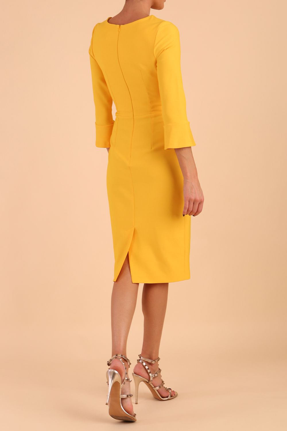 Model wearing diva catwalk Seed Orla Asymmetric Pencil Dress in Saffron Yellow front
