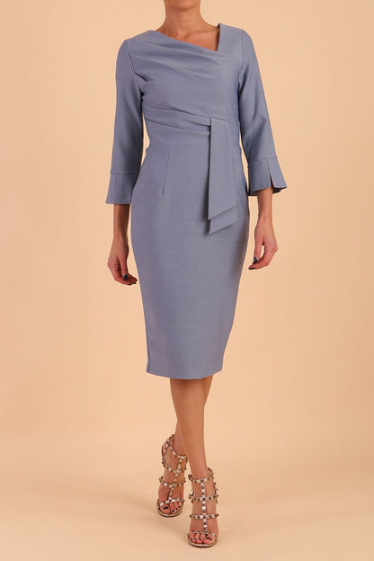 Model wearing diva catwalk Seed Orla Asymmetric Pencil Dress in Steel Blue front side