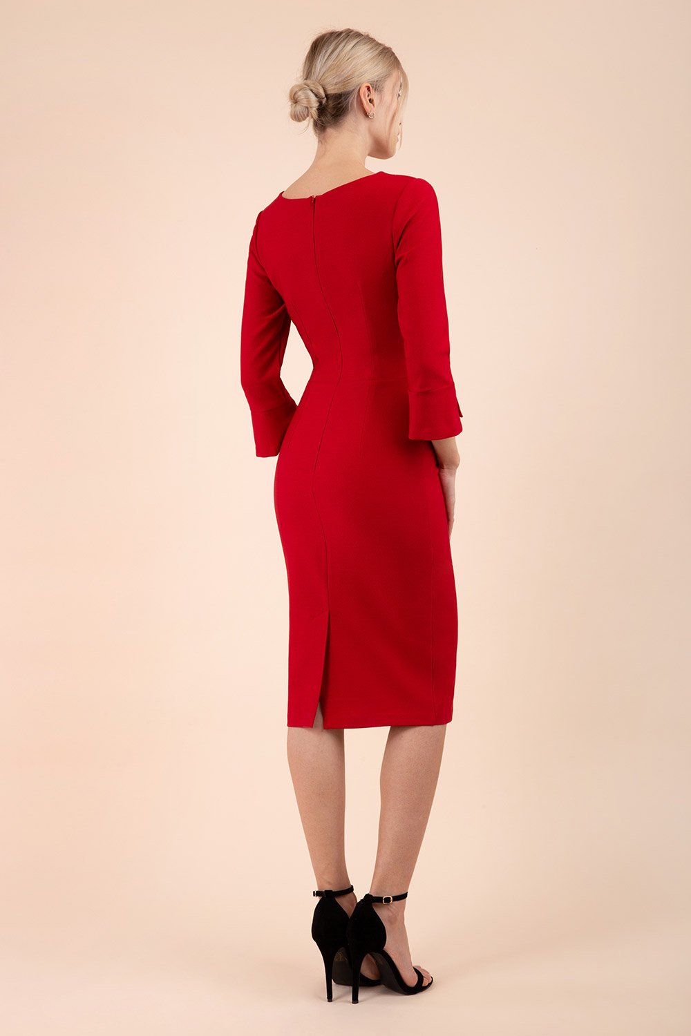 Model wearing diva catwalk Seed Orla Asymmetric Pencil Dress in Cardinal Red front