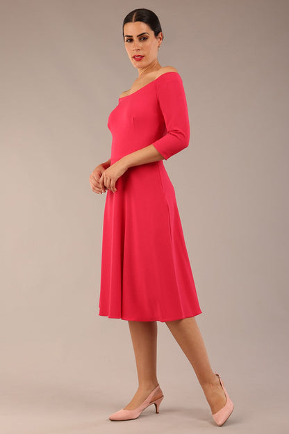 brunette model is wearing diva catwalk off shoulder swing a-line islay dress with sleeves in honeysuckle pink colour front image 