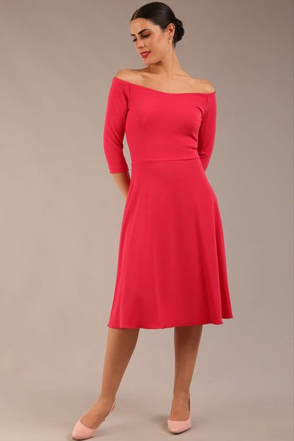 brunette model is wearing diva catwalk off shoulder swing a-line islay dress with sleeves in honeysuckle pink colour front image 