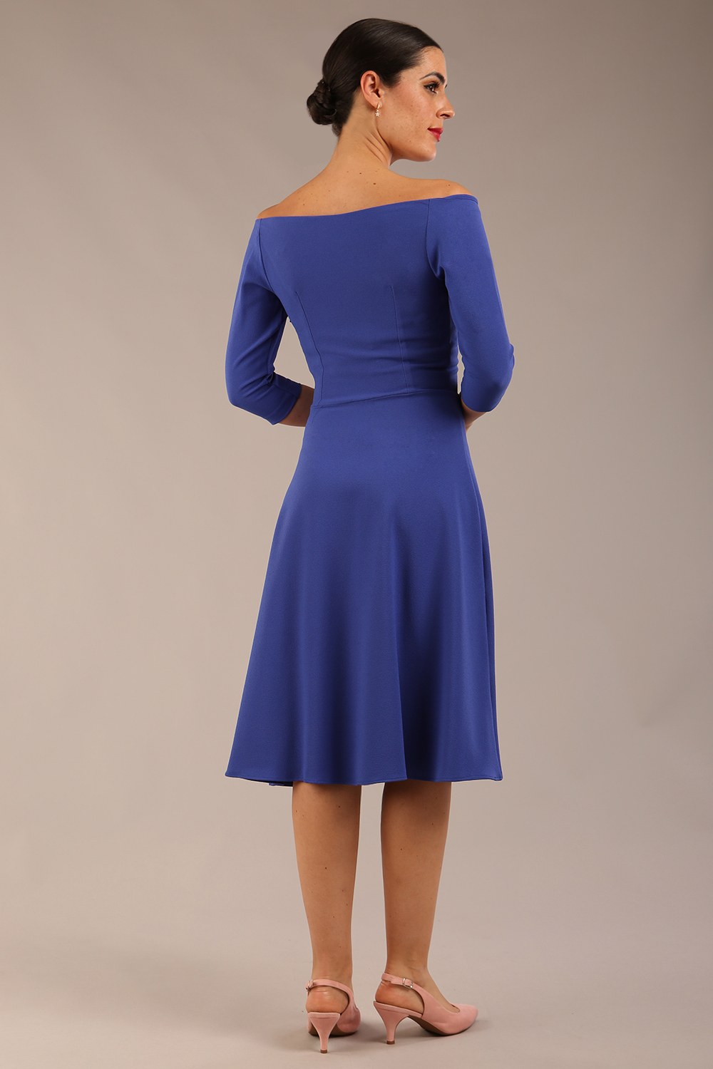 brunette model is wearing diva catwalk off shoulder swing a-line islay dress with sleeves in riviera blue colour front image 