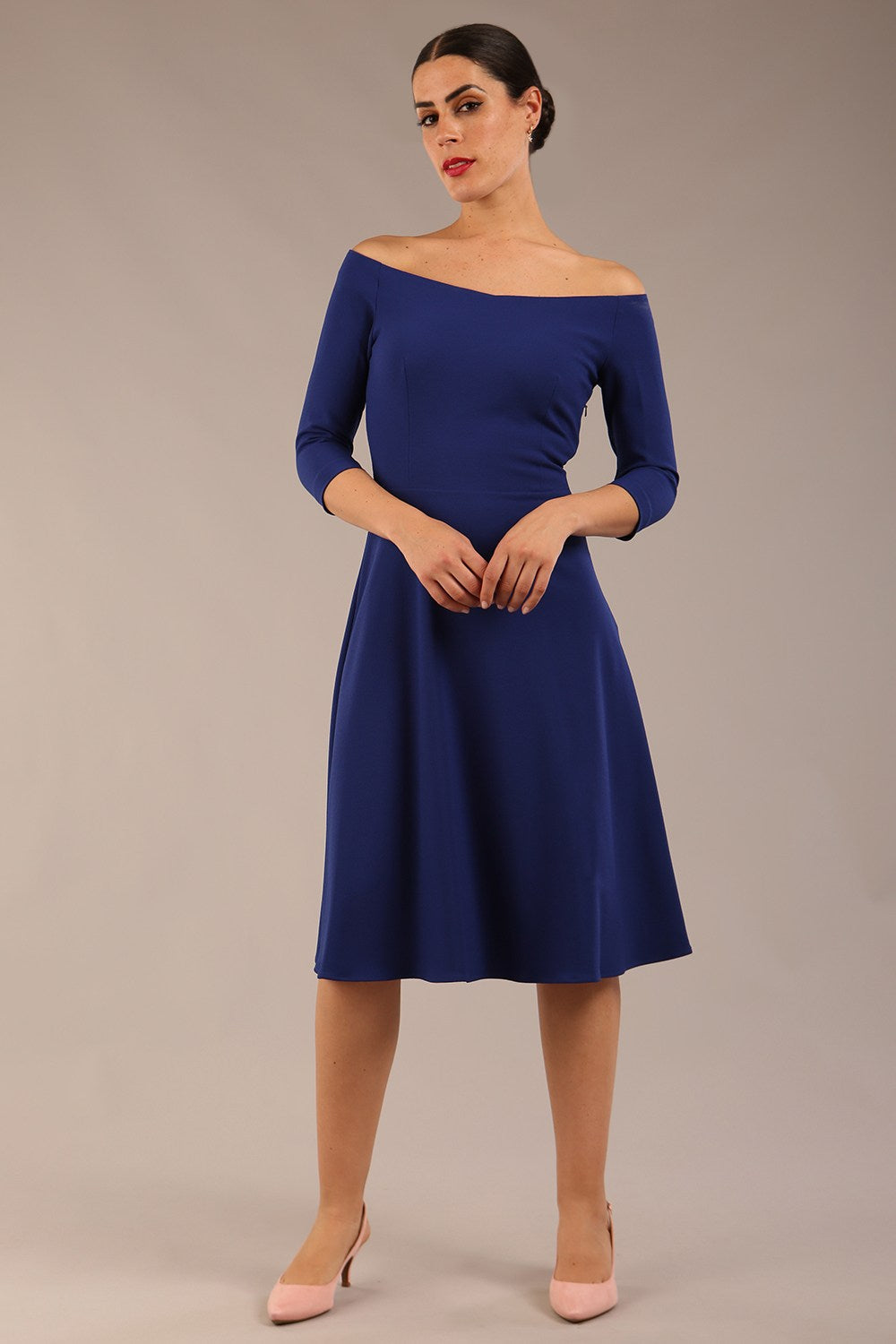 brunette model is wearing diva catwalk off shoulder swing a-line islay dress with sleeves in oxford blue colour front image 