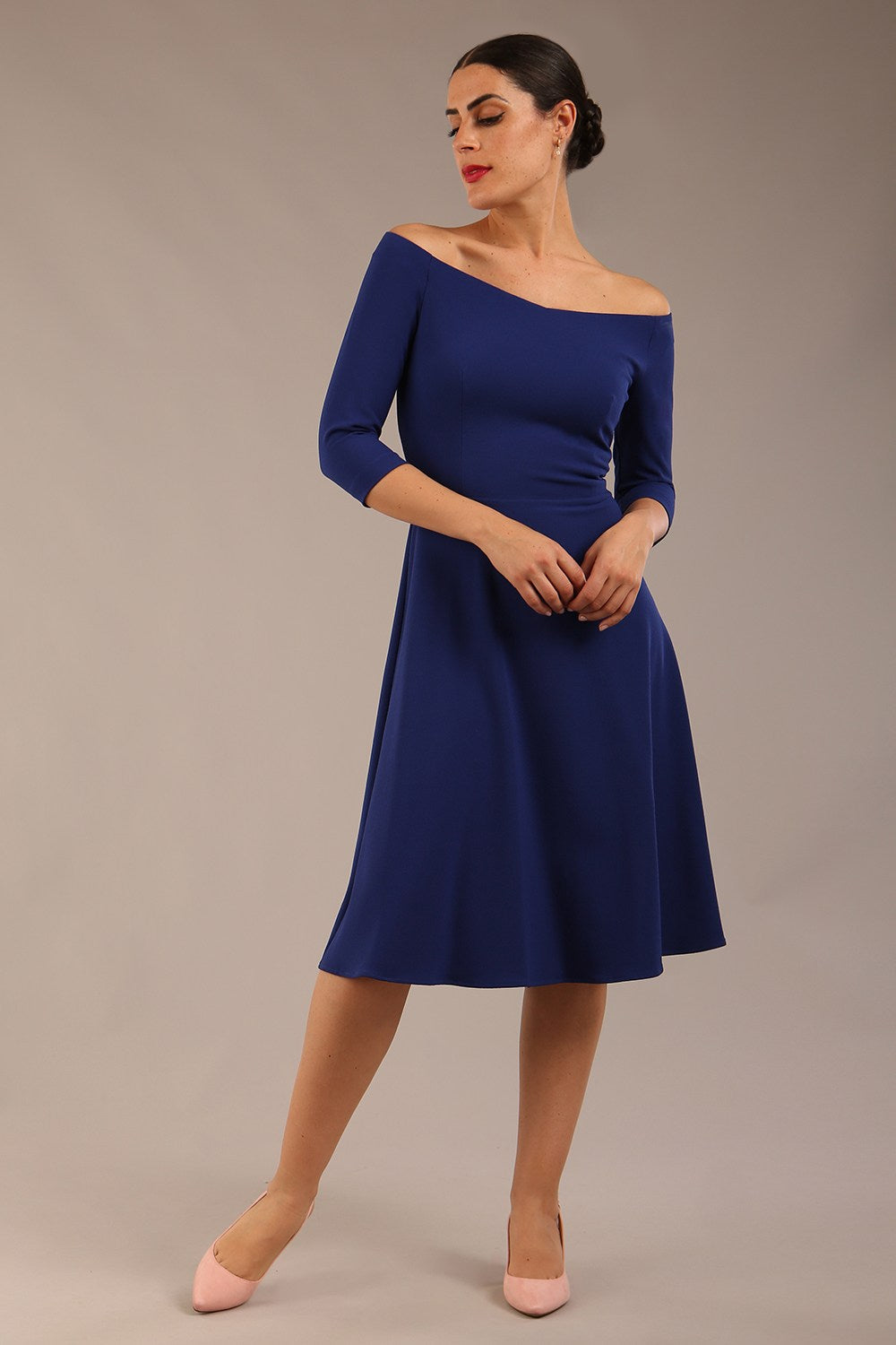 brunette model is wearing diva catwalk off shoulder swing a-line islay dress with sleeves in oxford blue colour front image 