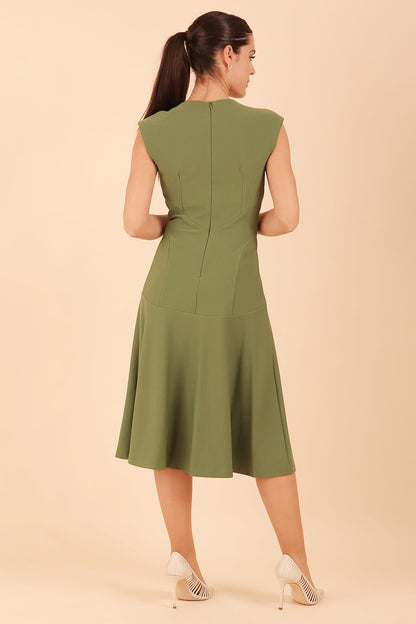 model wearing diva catwalk rochelle swing skirt a line dress without sleeves with a low v neck in vineyard green front