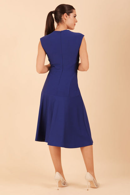 model wearing diva catwalk rochelle swing skirt a line dress without sleeves with a low v neck in cobalt front