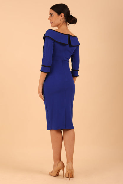 A Model is wearing an off shoulder three quarter sleeve pencil dress in cobalt blue by diva catwalk