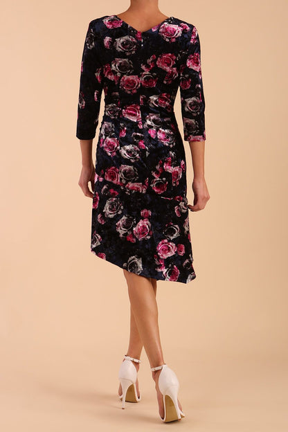 Model wearing Diva Catwalk Vella Asymmetric Dress 3/4 sleeve asymmetric hemline with v neckline in Rose Blossom Print side