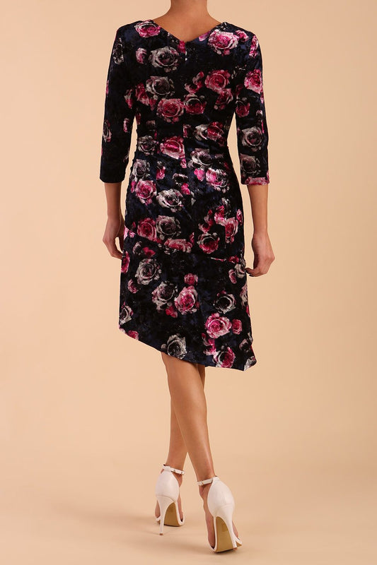 Model wearing Diva Catwalk Vella Asymmetric Dress 3/4 sleeve asymmetric hemline with v neckline in Rose Blossom Print side