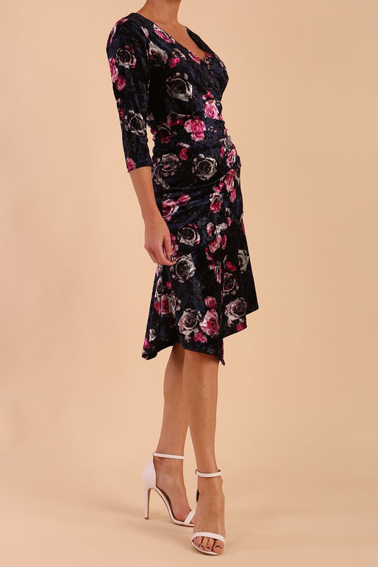 Model wearing Diva Catwalk Vella Asymmetric Dress 3/4 sleeve asymmetric hemline with v neckline in Rose Blossom Print side