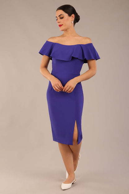 brunette model wearing diva catwalk pencil dress with off shoulder frilled front and bardot neckline in spectrum indigo  colour front (Spectrum Indigo)