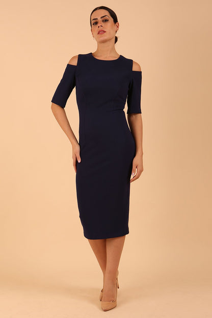 model is wearing diva catwalk solway pencil dress cold shoulder detail and rounded neckline in Navy Blue front side