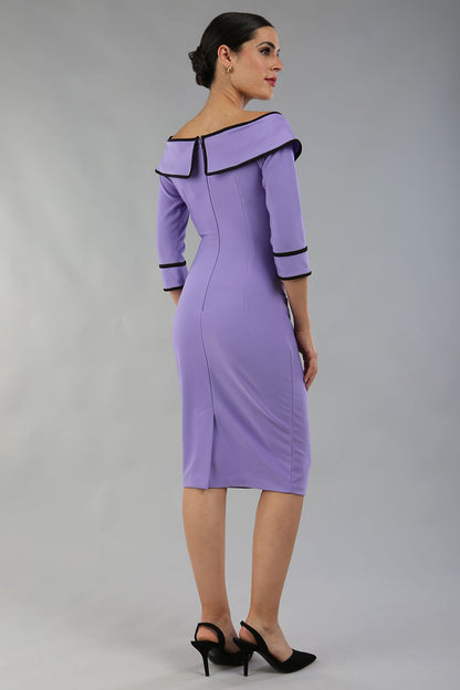 model wearing a diva catwalk Paige Bi-Stretch Dress with 3/4 sleeve, knee length, Fold over off-shoulder neckline with bow detail and with Contrast piping on sleeve cuffs and neckline in Lilac Wisteria and black colour