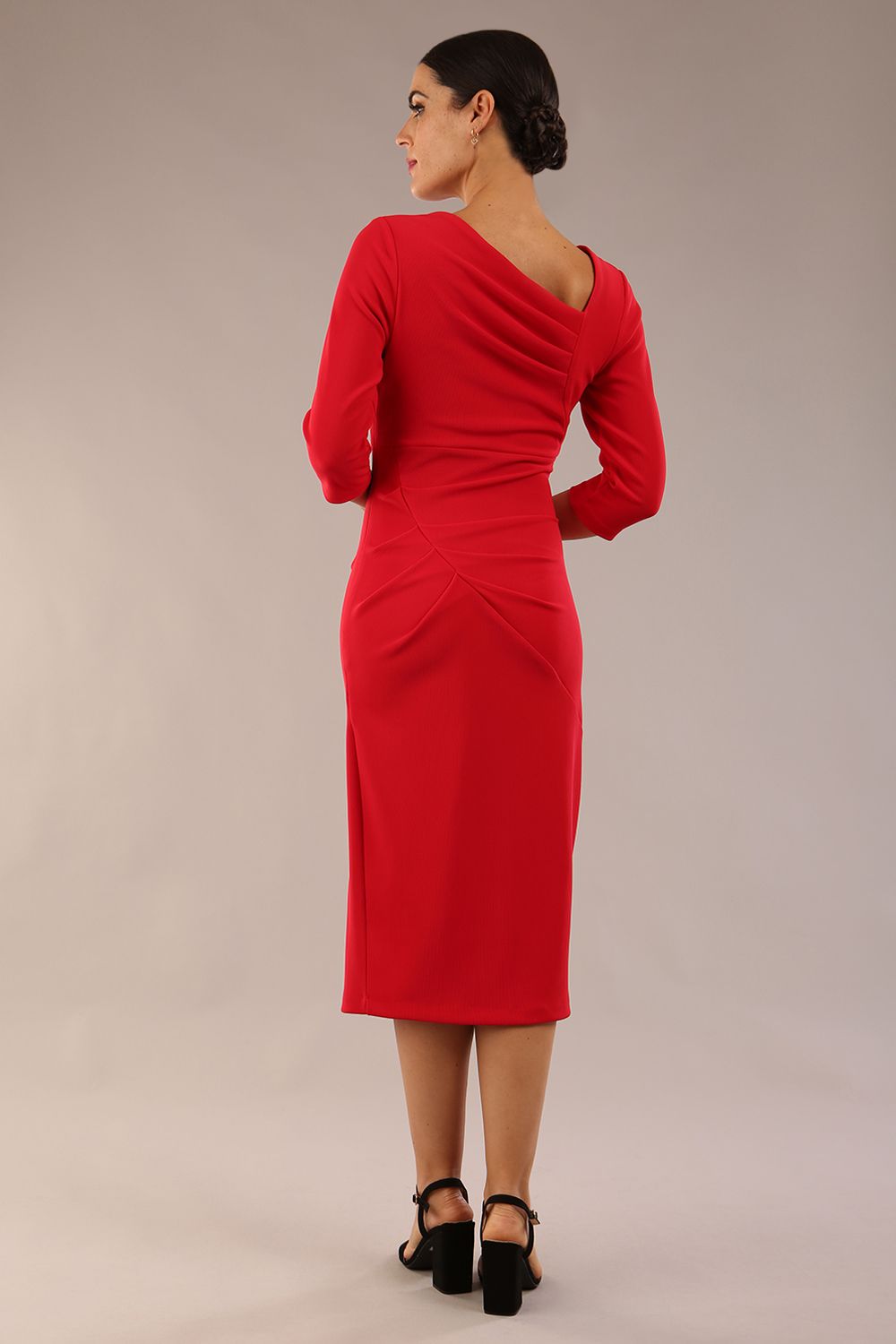 model is wearing a diva catwalk Amity Asymmetric Neckline Pleated front and back with 3/4 sleeves and front vent pencil Dress in True Red colour back