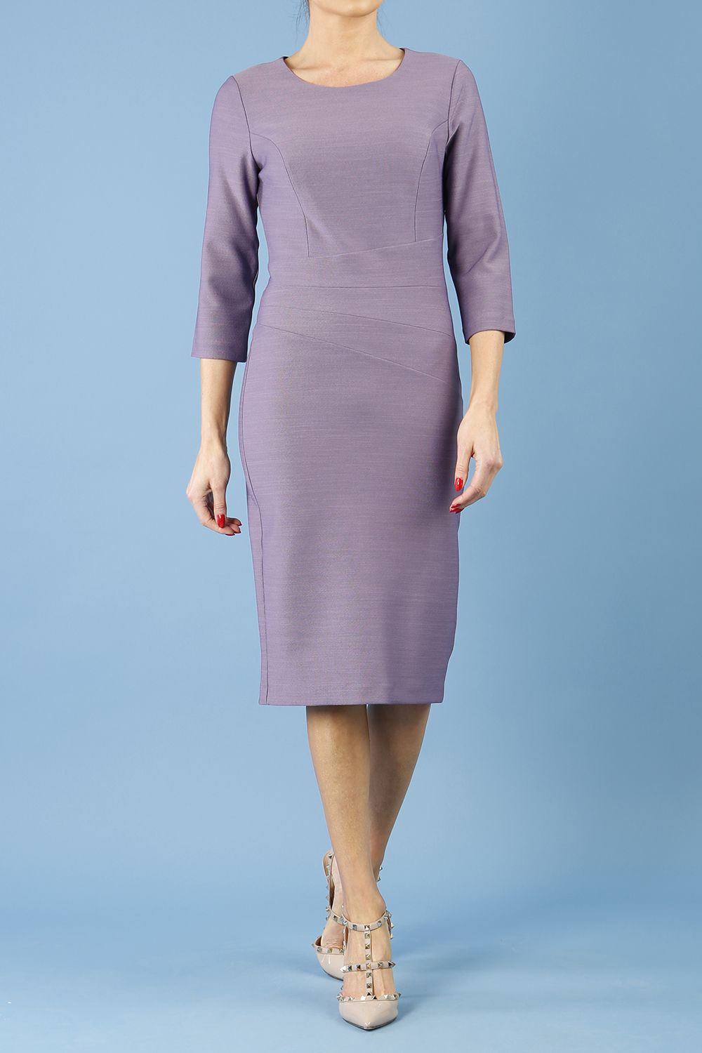 brunette model is wearing diva catwalk seed rosa plain dress with rounded neckline in dusky lilac front