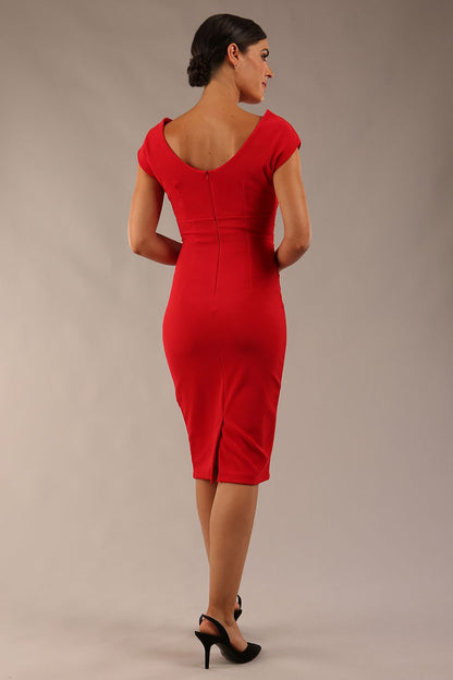 Model wearing Diva Catwalk Polly Rounded Neckline Pencil Cap Sleeve Dress with pleating across the tummy area in True Red front