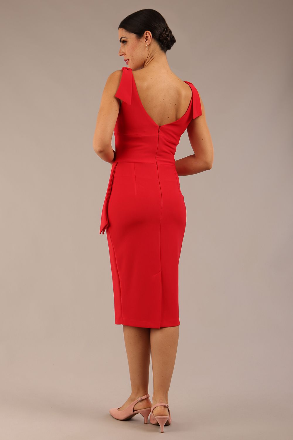 Model wearing diva catwalk Malvern Sleeveless Pencil Wiggle Dress with tie detail at waist and shoulders and open back in Electric Red colour back side