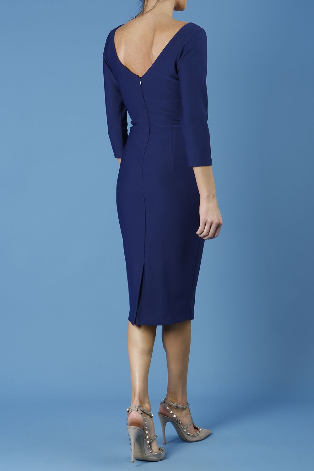 model is wearing diva catwalk regatta low v-neck sleeved pencil dress in navy blue front